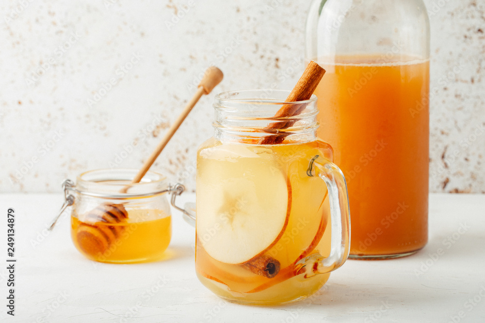 Cool, healthy drink with apple cider vinegar, honey, apples and cinnamon Cool, healthy drink with apple cider vinegar, honey, apples and cinnamon