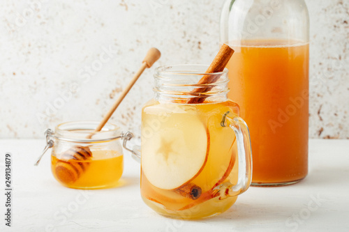 Cool, healthy drink with apple cider vinegar, honey, apples and cinnamon