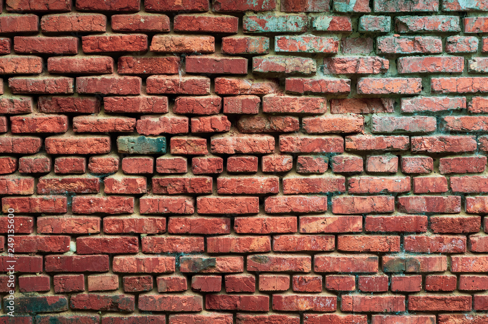Background from an old brick wall with red bricks with a shabby texture Background from an old brick wall with red bricks with a shabby texture