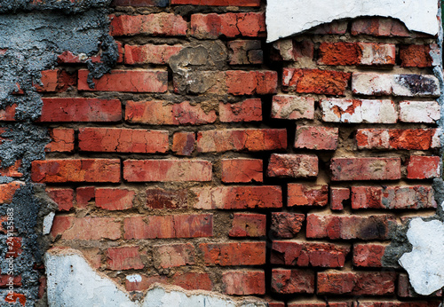 Cuadro en lienzo Background from an old brick wall with red bricks with a shabby texture