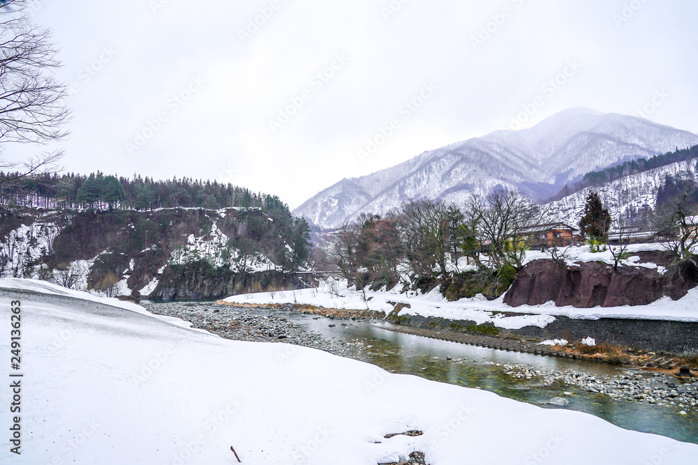 Fototapeta premium Villages of Shirakawago and Gokayama are one of Japan's UNESCO World Heritage Sites. Farm house in the village and mountain behind.