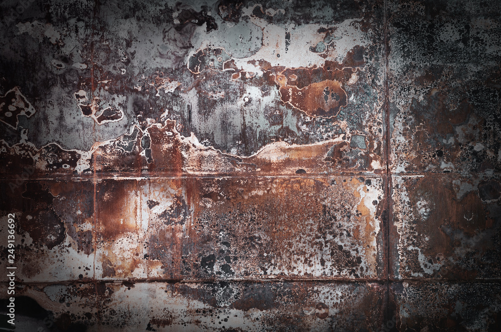 Background from old rusty metal sheets bonded to each other by argon welding Background from old rusty metal sheets bonded to each other by argon welding