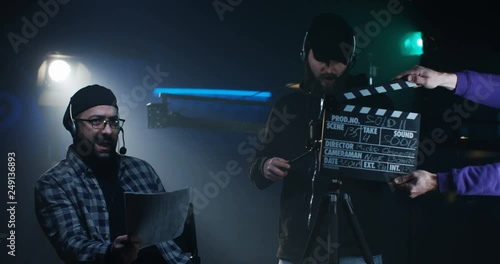 Young director giving instructions on a film set