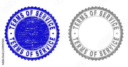 Grunge TERMS OF SERVICE stamp seals isolated on a white background. Rosette seals with grunge texture in blue and grey colors.