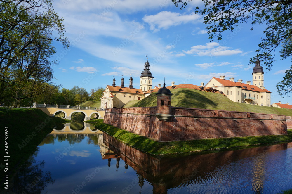 Nesvizh Castle on a sunny day. Nyasvizh, Nieśwież, Nesvizh, Niasvizh, Nesvyzhius, Nieświeżh, in Minsk Region, Belarus. Site of residential castle of the Radziwill family. 