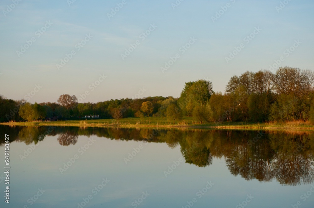 Reflection of Nesvizh Castle in the pond in autumn. Nyasvizh, Nieśwież, Nesvizh, Niasvizh, Nesvyzhius, Nieświeżh, in Minsk Region, Belarus. Site of residential castle of the Radziwill family. 