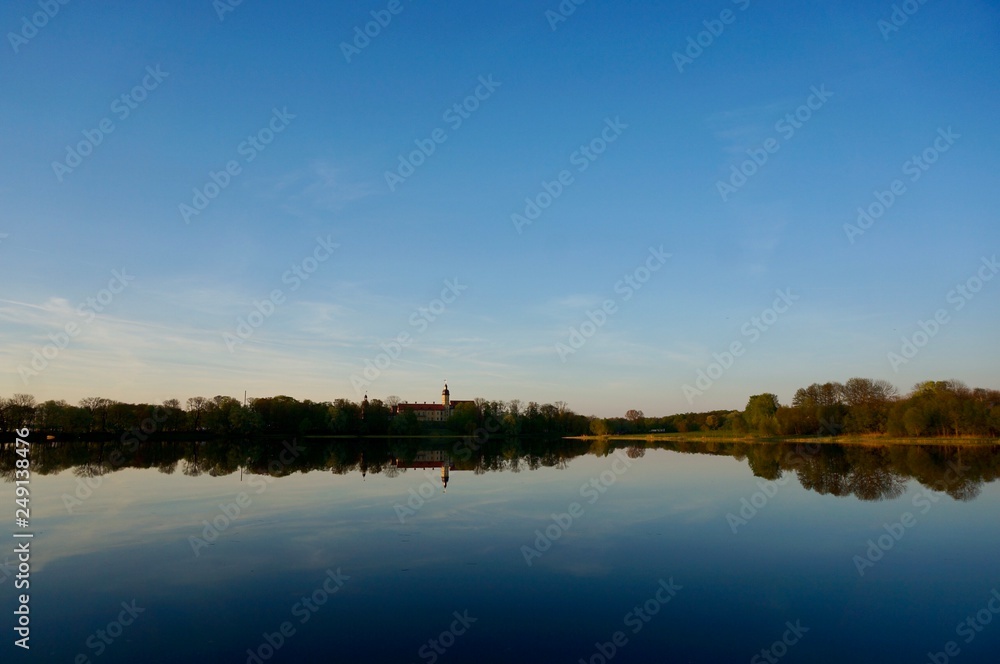Fototapeta premium Reflection of Nesvizh Castle in the pond in autumn. Nyasvizh, Nieśwież, Nesvizh,&nbsp;Niasvizh, Nesvyzhius, Nieświeżh, in Minsk Region, Belarus. Site of residential castle of the Radziwill family. 