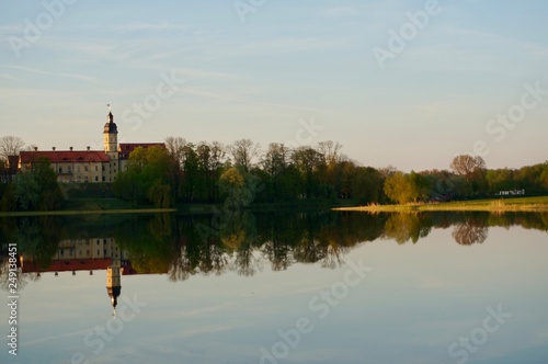 Reflection of Nesvizh Castle in the pond in autumn. Nyasvizh, Nieśwież, Nesvizh, Niasvizh, Nesvyzhius, Nieświeżh, in Minsk Region, Belarus. Site of residential castle of the Radziwill family. 
