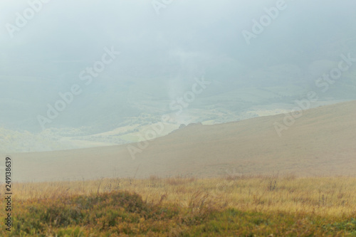View of the mountains with fog. © Konstiantyn Zapylaie