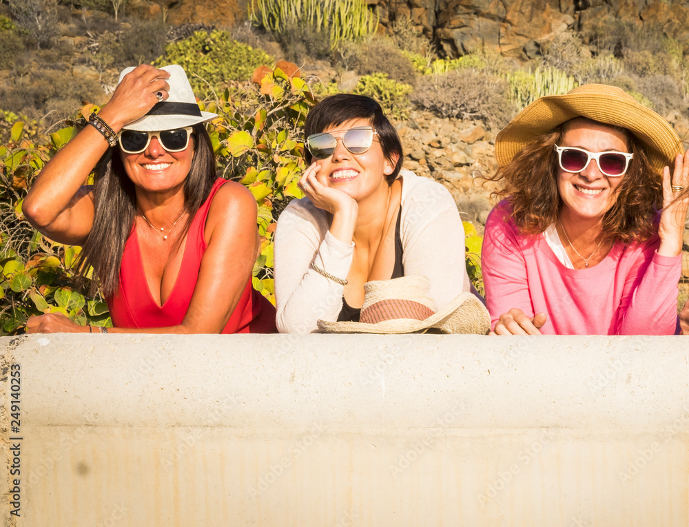 Φωτογραφία Three middle age young woman smile and enojy the sunny day in outdoor leisure ac