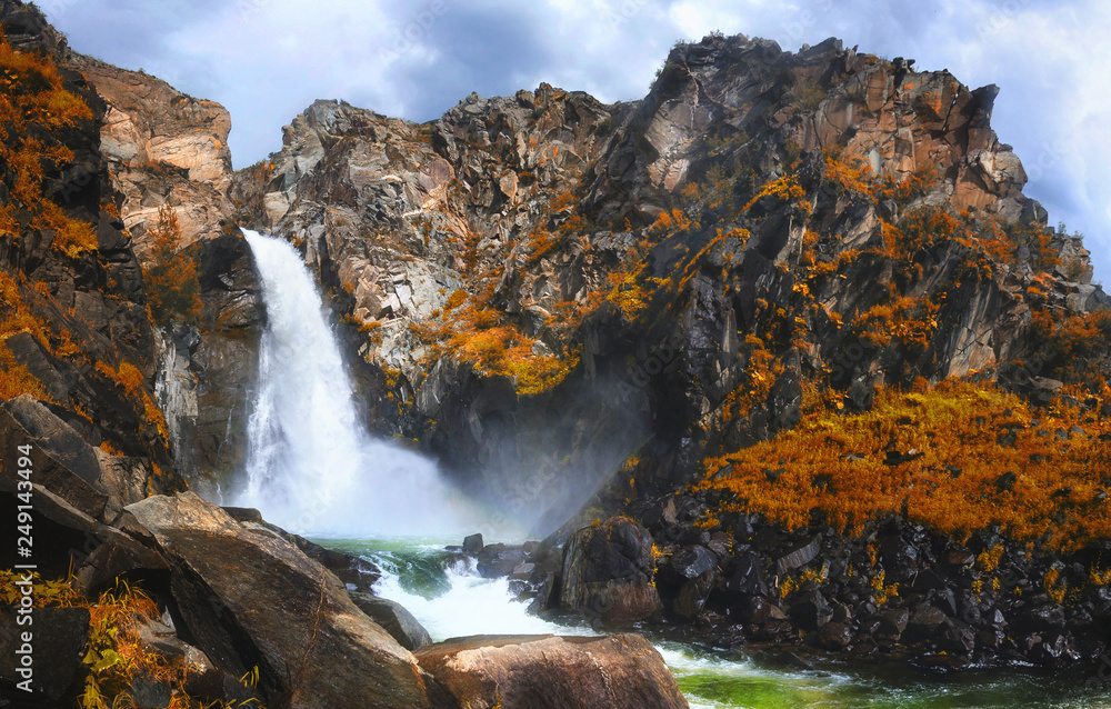 Autumn view of Kurkure waterfall in the mountains of Altai region, Siberia, Russia