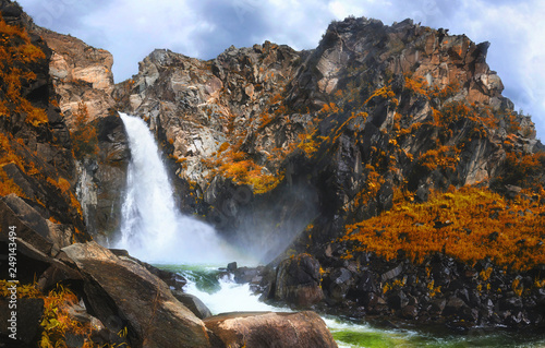 Autumn view of Kurkure waterfall in the mountains of Altai region, Siberia, Russia