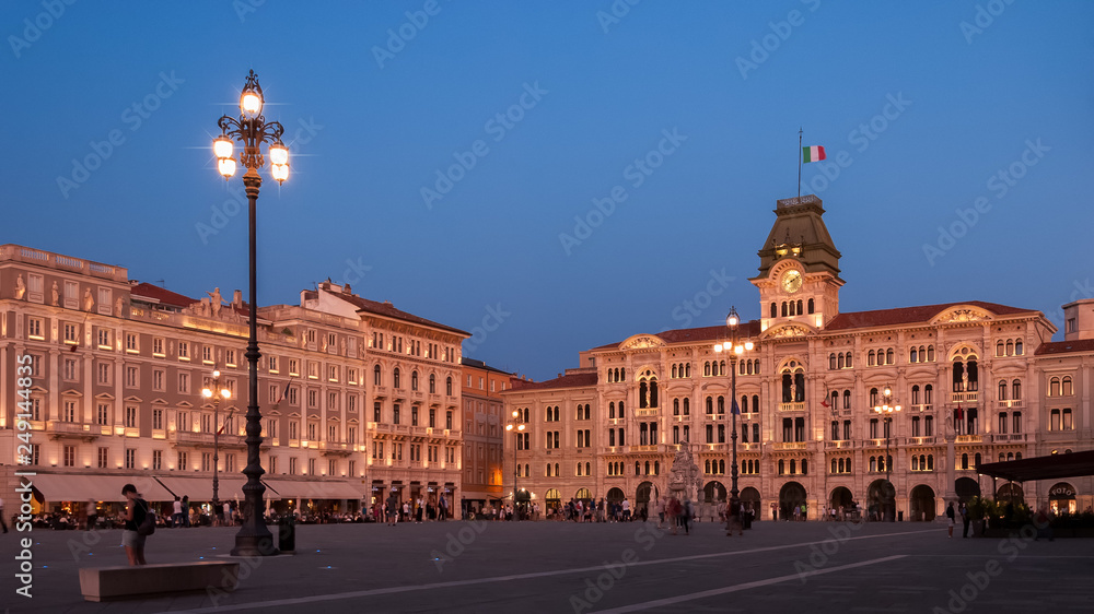 Piazza dell'Unita in Trieste with Palazzo del Municipio shot at sunset in soft pink light