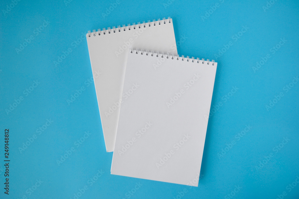 school notebook on blue background school notebook on blue background