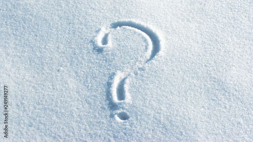 Question mark in the light blue bright snow