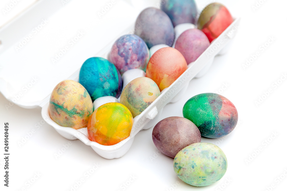 Group of Easter painted eggs in white container Group of Easter painted eggs in white container