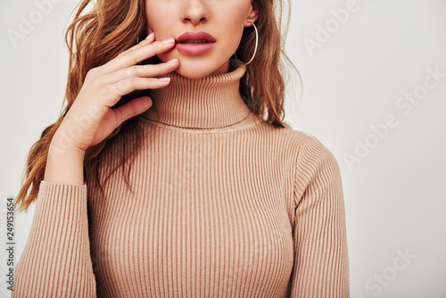 Perfect in every way. Close up of female face and body, isolated over white background