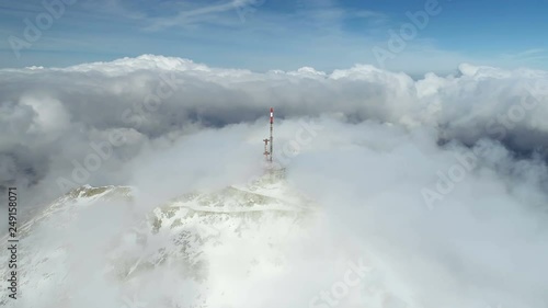 Stunning mountain winter landscape of Stirovnik peak with telecommunication tower, the highest summit of the Lovcen National Park. photo