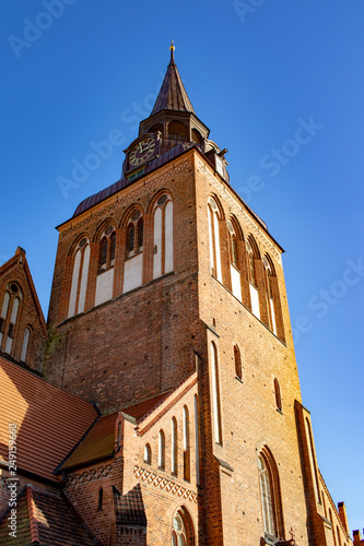 Steeple of an old church in germany in front of blue cloudless sky