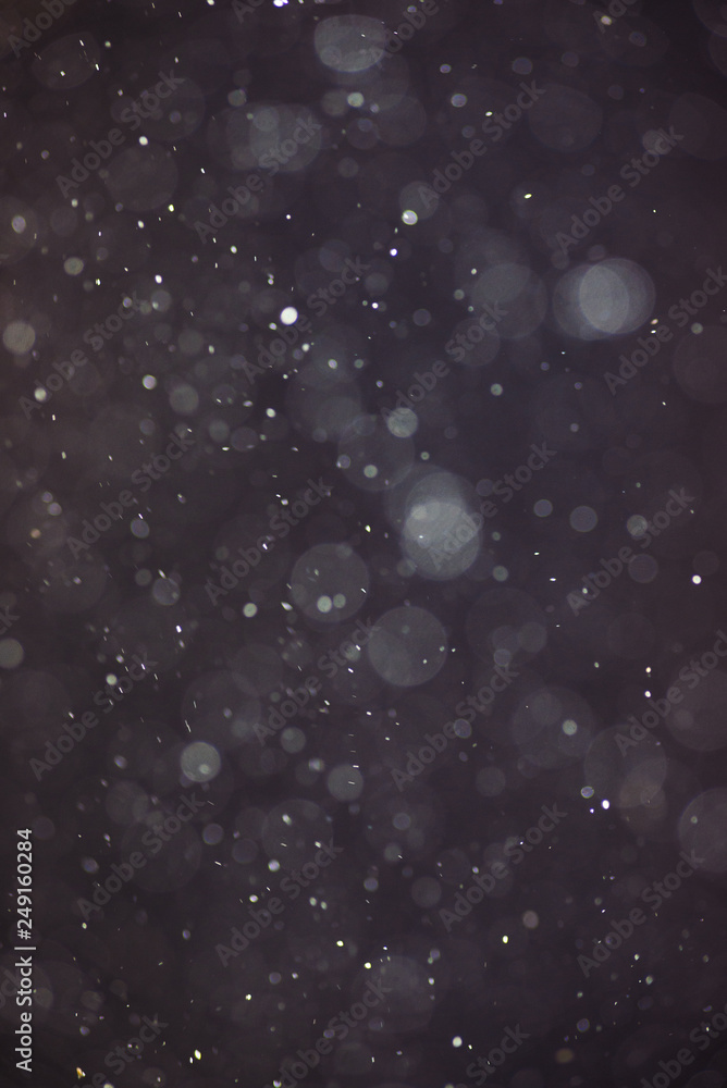 Fotografie Abstract bokeh circles in water