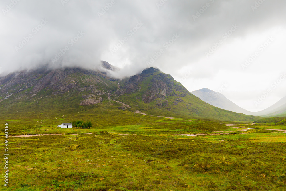 panorama of scottish hills with white hut panorama of scottish hills with white hut