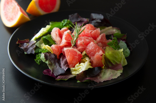 Healthy salad grapefruit and green leaves. Deliciouse dietary food. lose weigh.