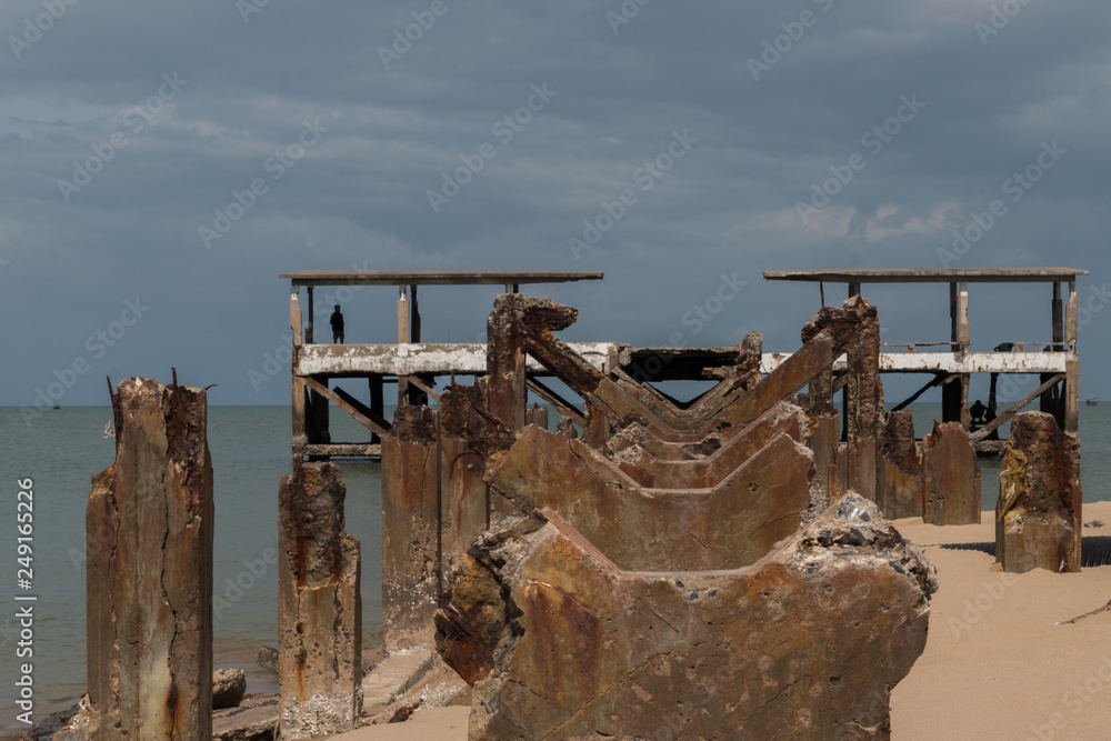 Ruin quay located near coast.The bridge is broken.The ruin is a type of concrete waste. Ruin quay located near coast.The bridge is broken.The ruin is a type of concrete waste.