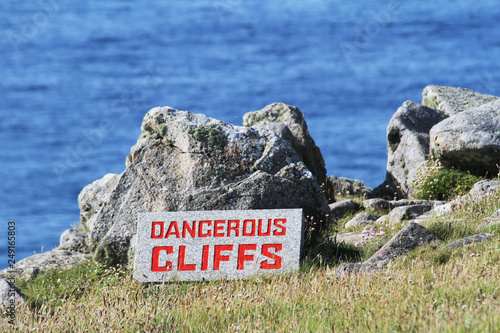Dangerous Cliff sign at Land's end, edge of England, Cornwall, UK
