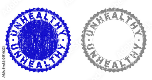 Grunge UNHEALTHY stamp seals isolated on a white background. Rosette seals with grunge texture in blue and grey colors. Vector rubber stamp imprint of UNHEALTHY tag inside round rosette.