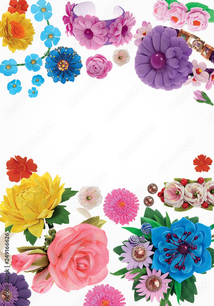 Arrangement of flowers and ornaments of foamiran on a white background with a texture.