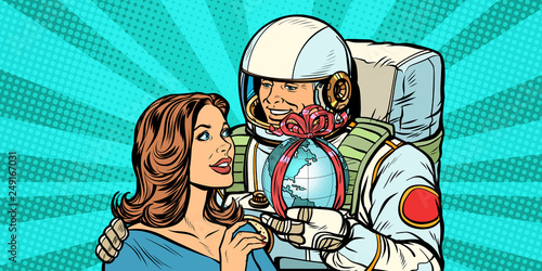 Couple in love. Astronaut gives a woman the Earth