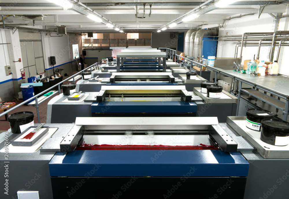 Press printing - Offset machine. Printing technique where the inked image is transferred from a plate to a rubber blanket, then to the printing surface. Press printing - Offset machine. Printing technique where the inked image is transferred from a plate to a rubber blanket, then to the printing surface.