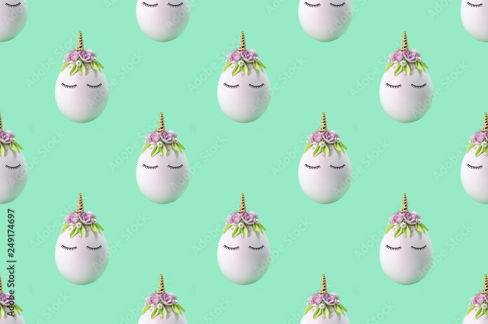 Pattern of cute unicorns made of eggs. Easter background Pattern of cute unicorns made of eggs. Easter background
