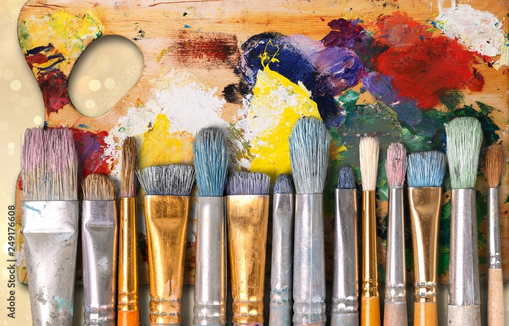 Fototapeta premium Artist paint brushes and paint cans