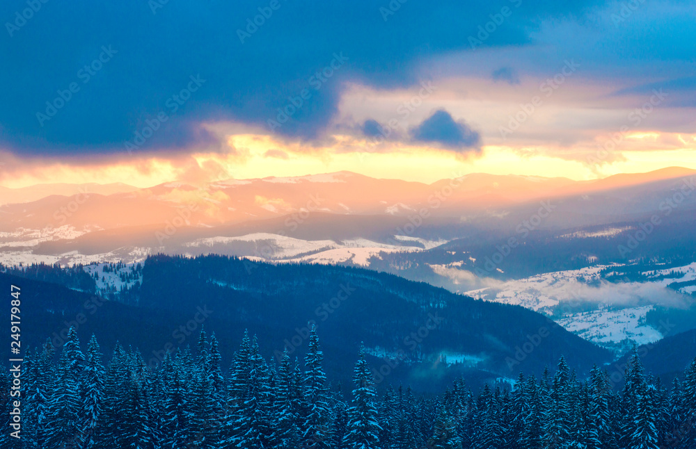 mountains in the snow on a background of clouds in the winter mountains in the snow on a background of clouds in the winter