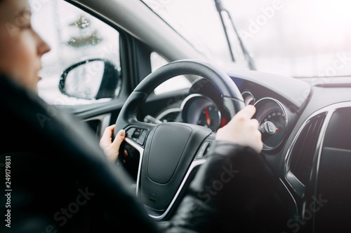 girl driving a car. modern interior.