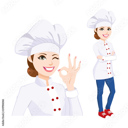 Young confident chef woman standing in uniform winking one eye and gesturing ok hand sign