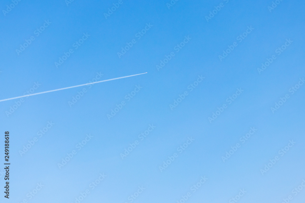 on the background of blue sky white trail from the aircraft. on the background of blue sky white trail from the aircraft.