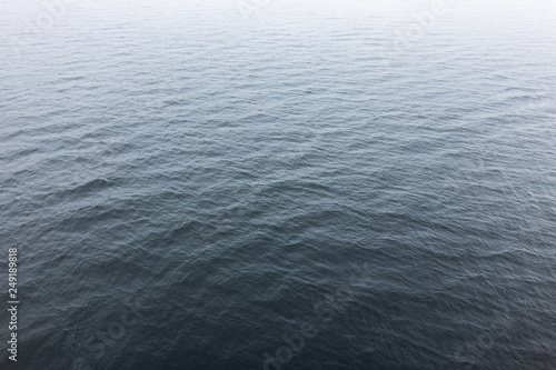 water surface in the fog. small ripples on the water. background