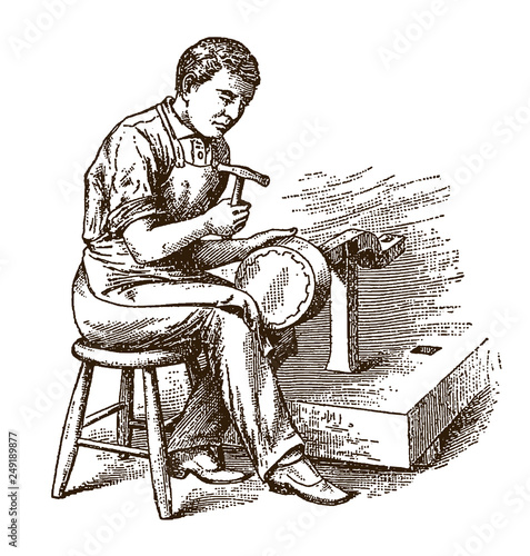 Antique coppersmith sitting on chair and planishing kettle, cauldron or pot with hammer, after engraving from 19th century