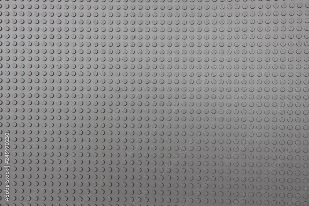 background. Gray plastic game board for a children's designer. background. Gray plastic game board for a children's designer.