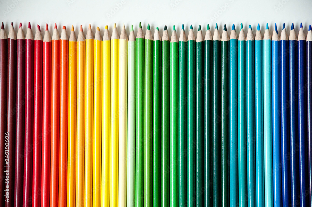 Many multi-colored pencils. Background with color pencils. Rainbow