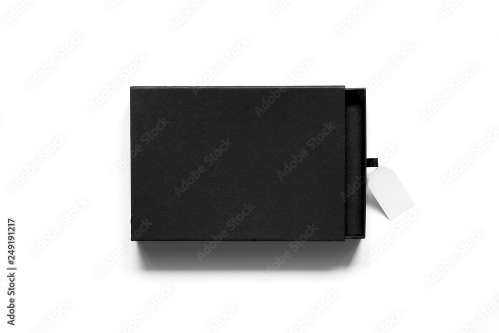 Flatlay of black cardboard box with red label on white background. Flatlay of black cardboard box with red label on white background.
