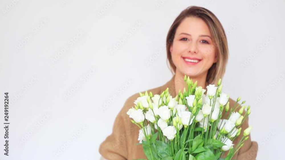 Beautiful girl with white fresh roses on white background. Beautiful girl with white fresh roses on white background.
