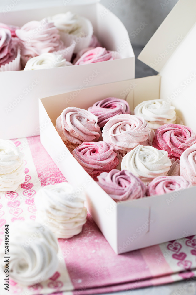 dessert zephyr marshmallows close up. Big zephyr sprinkled with powdered sugar. Valentine's Day concept. Food photography dessert zephyr marshmallows close up. Big zephyr sprinkled with powdered sugar. Valentine's Day concept. Food photography