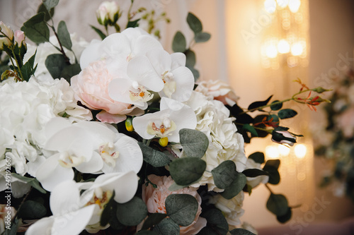 Artificial flowers in bouquet, real sensations, on white background photo