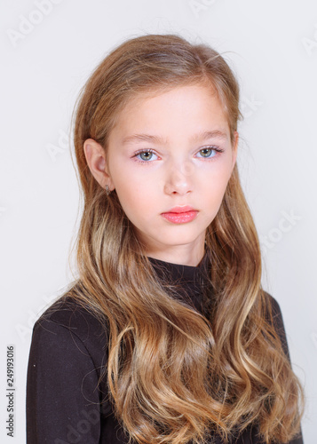 portrait of little model girl in studio