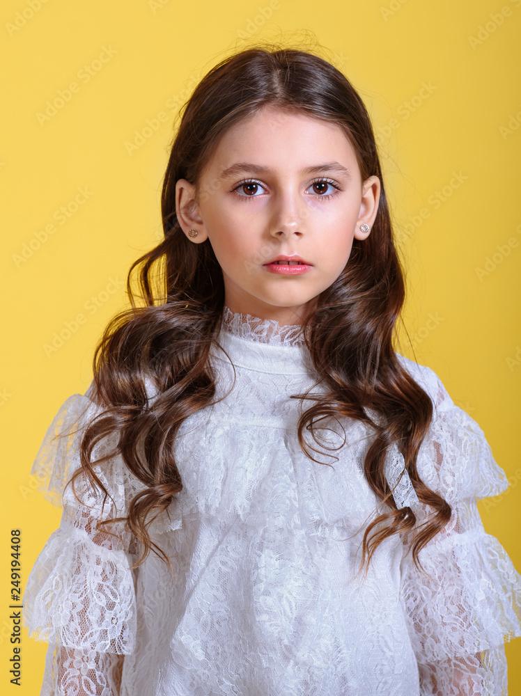 portrait of little model girl in studio