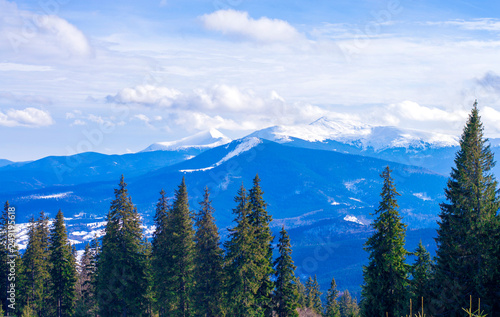 mountains in the snow on a background of clouds in the winter