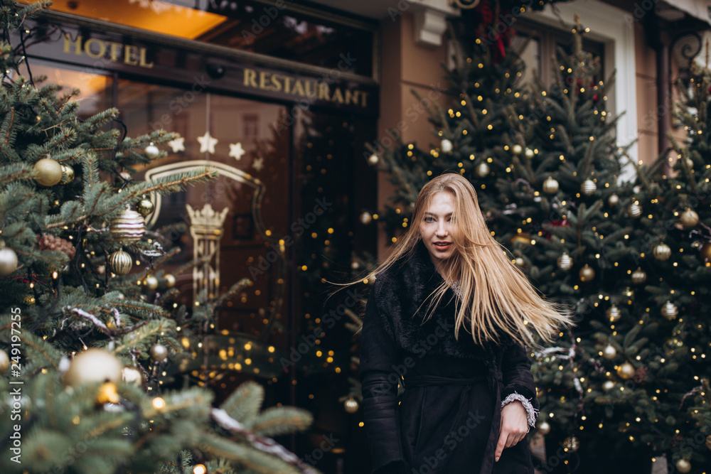© Andreshkova Nastya - Young blondie girl outdoors. Christmas time. New year eve. Happy young cheerful girl